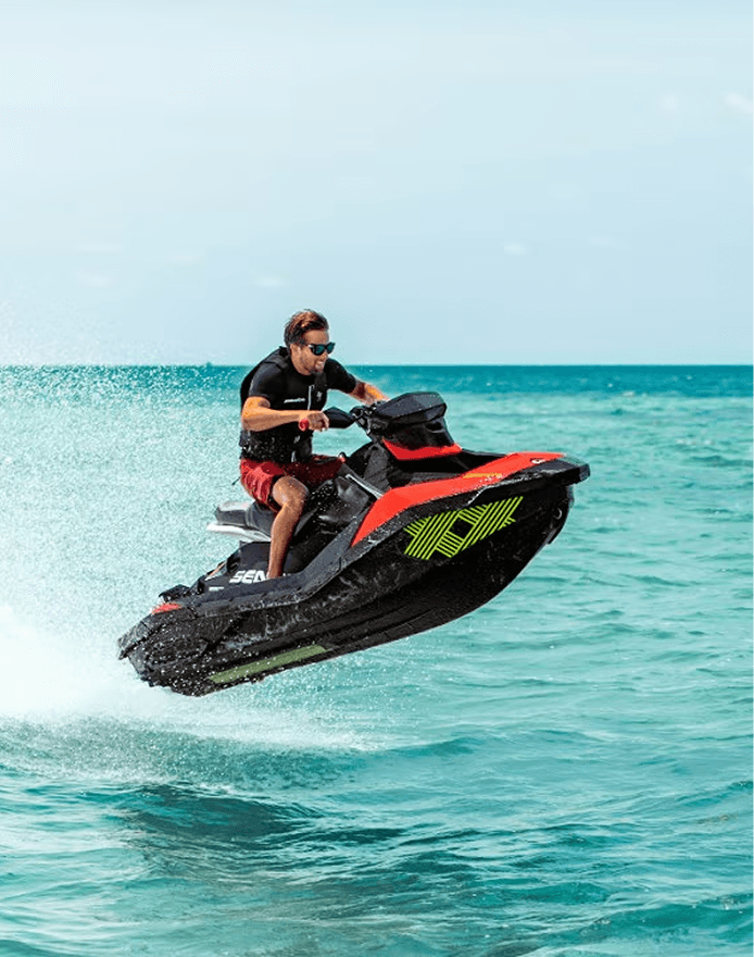 Jet ski rider jumping above the water