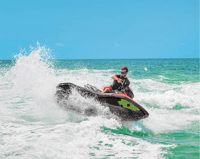 Jet ski riding through waves