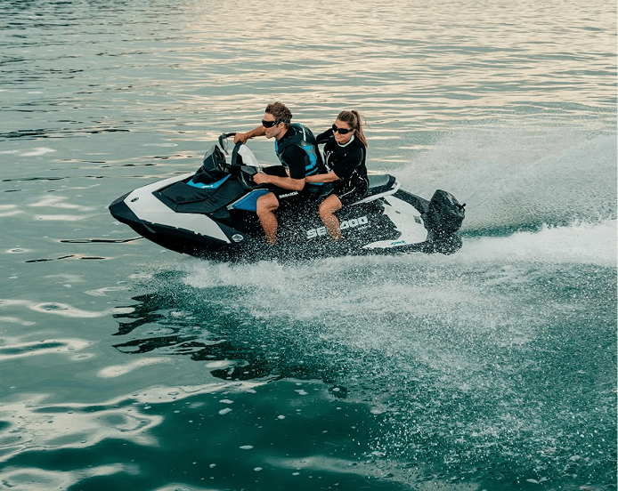 Two riders on a personal watercraft